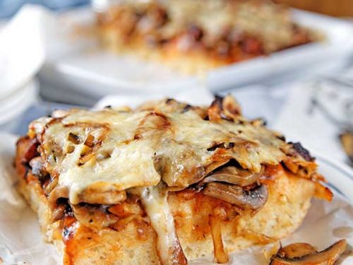 homemade pizza with mushrooms and onion