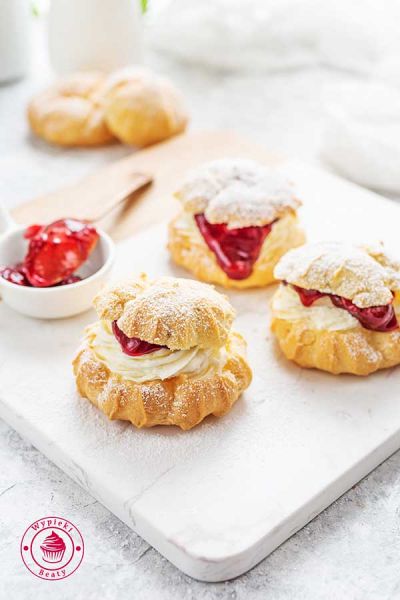 Choux pastries with cream and fruit choux pastries with cream and fruit jelly