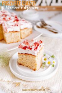 Stracciatella cake with strawberries a piece of cake with white frosting and flowers