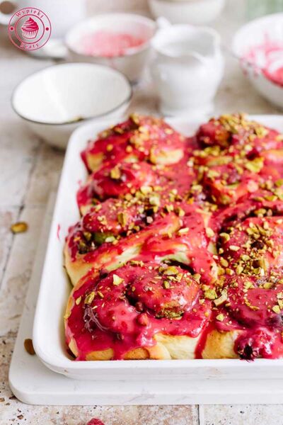 pistachio rolls with raspberry iceing