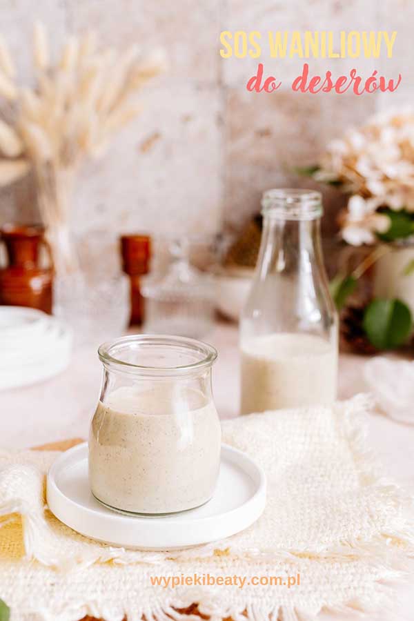 a glass jar with vanilla sause on a white plate