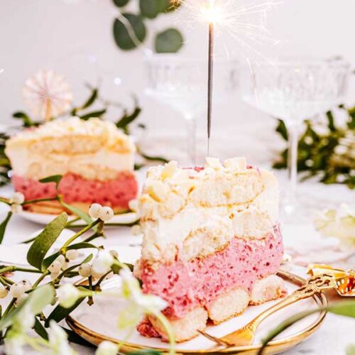 a slice of cake with a sparkler