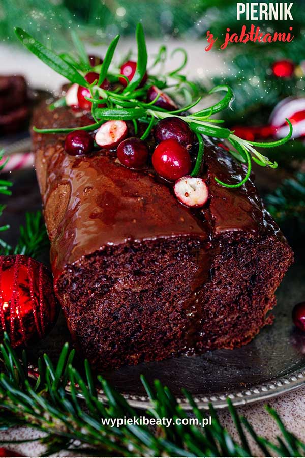 a chocolate cake with cranberries and rosemary