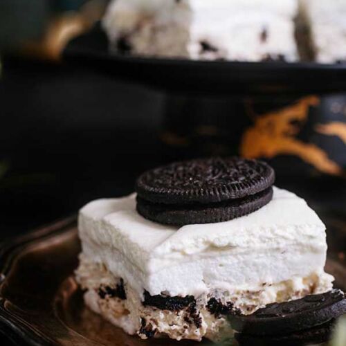 a piece of cake with a cookie on top