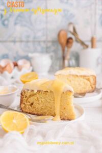 a slice of lemon cake with lemons on a plate