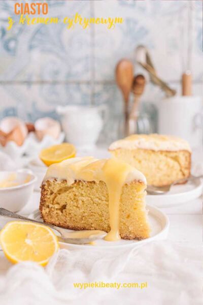 a slice of lemon cake with lemons on a plate