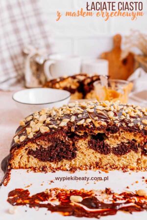a piece of cake with chocolate frosting and nuts