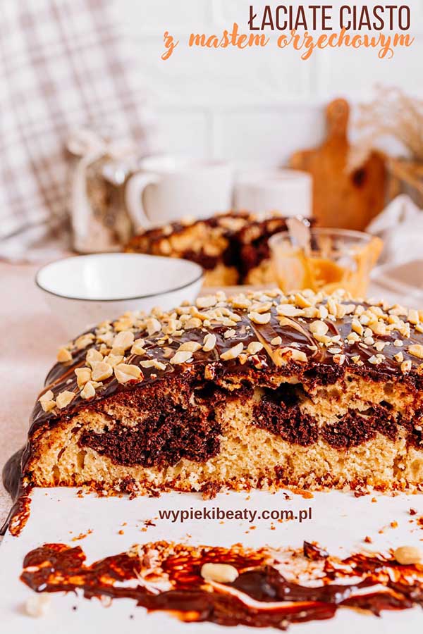 a piece of cake with chocolate frosting and nuts