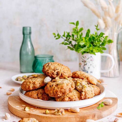 a plate of cookies on a wooden board