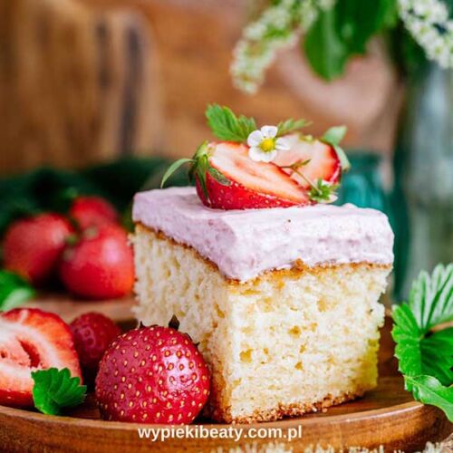 a piece of cake with strawberries on top
