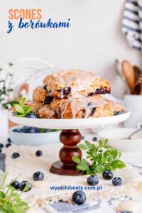 Ciasto z borówkami i makiem a stack of blueberry scones on a white plate