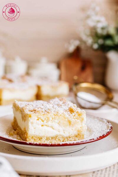 a slice of cheesecake with streusel on top