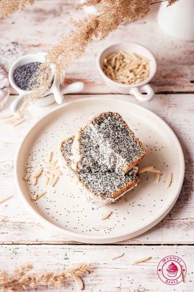 light speckled cake with poppy seeds and icing quick cake with egg whites baked with whole poppy seeds